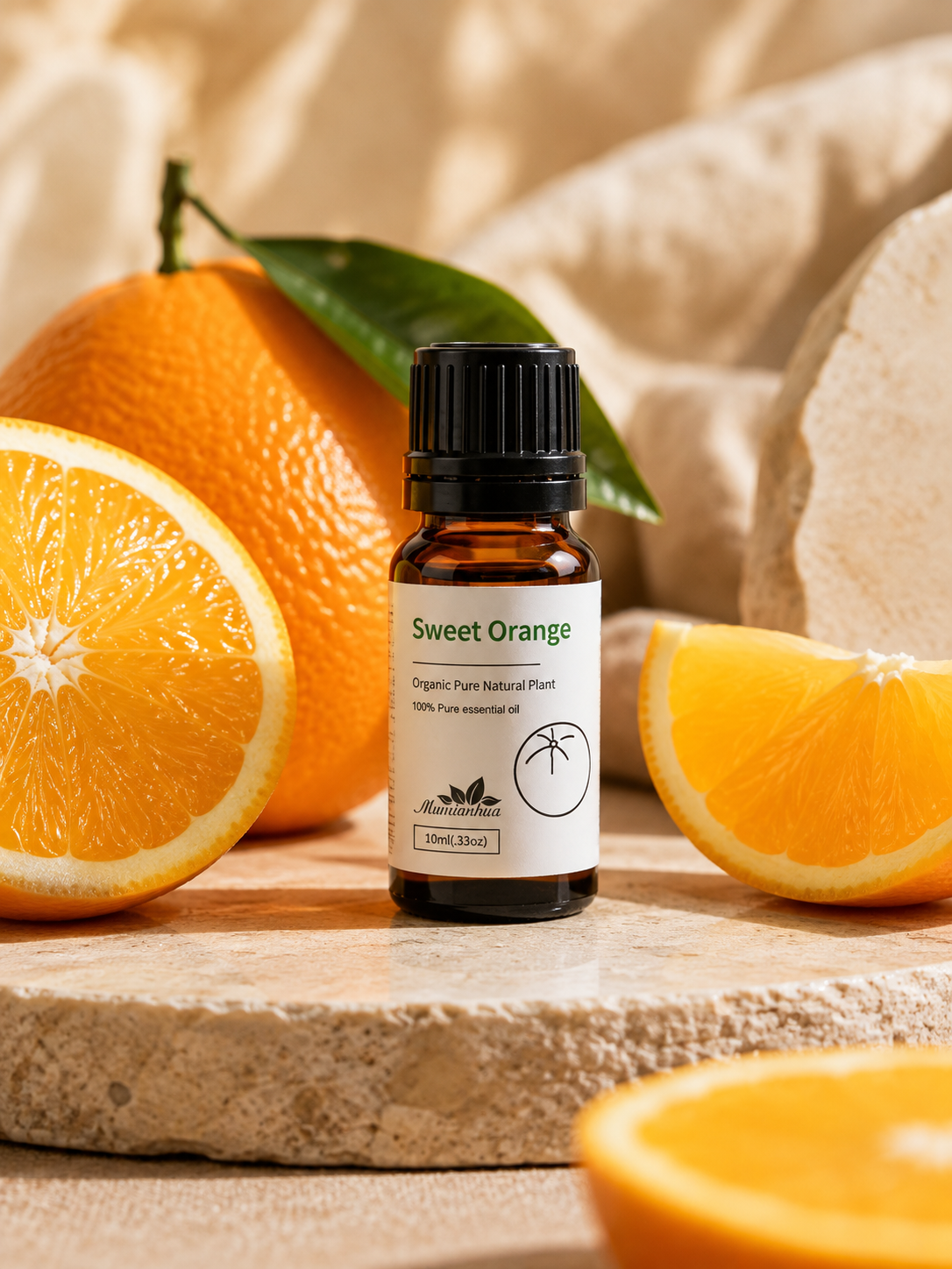 Amber Wellthious essential oil bottle beside fresh sweet oranges on a stone surface