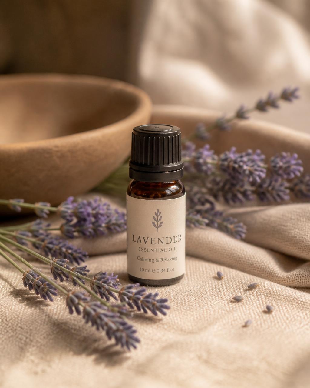 Amber Wellthious essential oil bottle surrounded by fresh lavender sprigs on warm linen