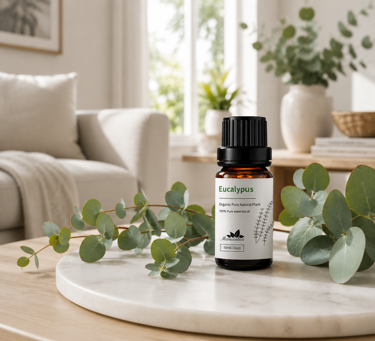 A fresh home ritual with an amber essential oil bottle, eucalyptus and tea tree branches in a bright modern living room
