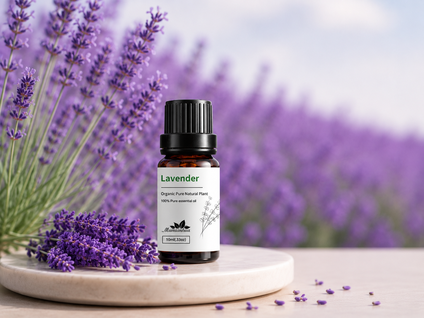 A Lavender essential oil bottle with its original supplier label on a round stone tray, surrounded by fresh lavender sprigs in a sunlit lavender field